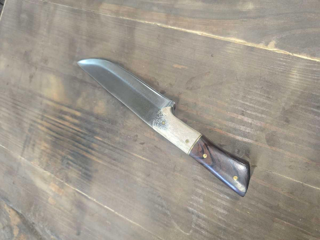 Angled view of desert ironwood and elk antler handle with brass divider