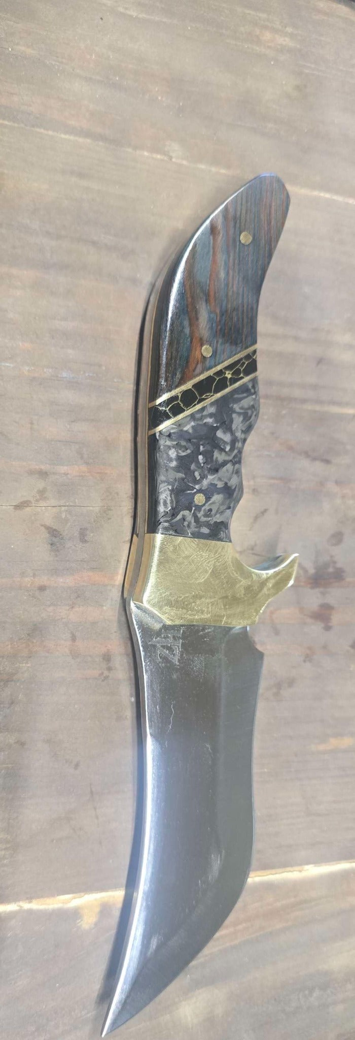 Close view of carbon fiber and dyed redwood handle with brass and composite marble divider